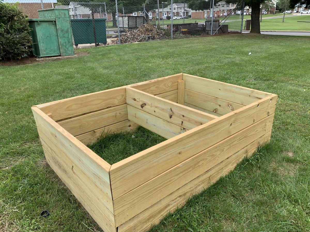 Picture of wooden framed raised garden bed before plantng.